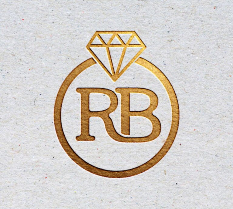Digital Illustration Rb Monogram Logo For Ruby Beauty, The Letters Rb Inside A Diamond Ring, Presented As An Embossed Gold Stamp On Natural Fibre Paper.